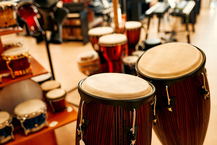 Different types of drums in music store feat